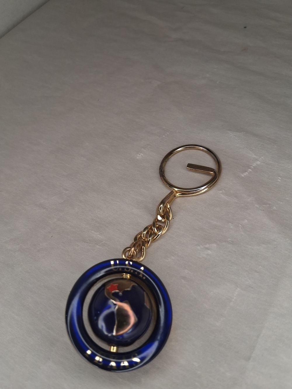 Gold Tone Keyring with Blue Enamel Round Charm